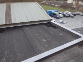 Renovatie + nieuwbouw plat dak Opel garage te Langdorp